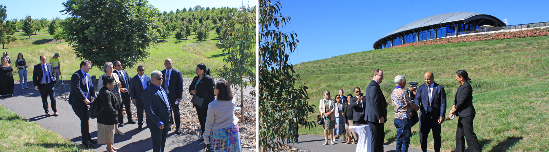 Group of VIP dignitaries walking along path 
