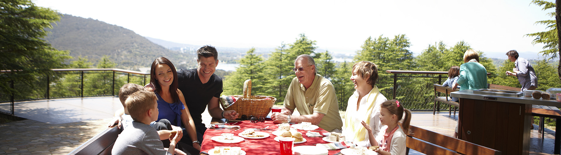 Family enjoying a picnic at the Himalayan cedar forest BBQ area and lookout