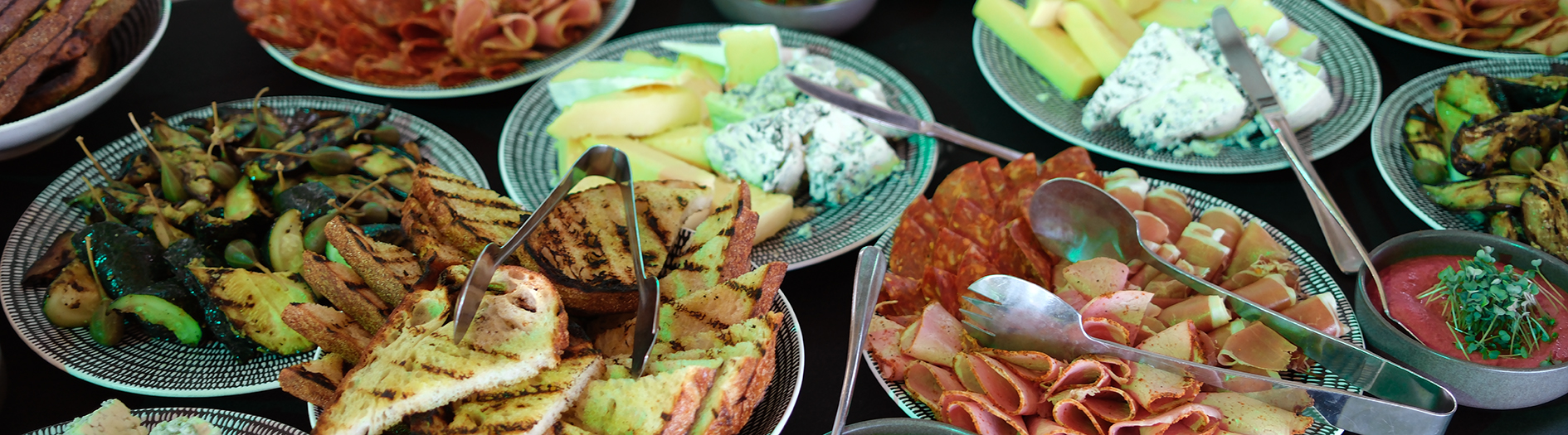 platters of delicious looking breads, cheeses and antipasto