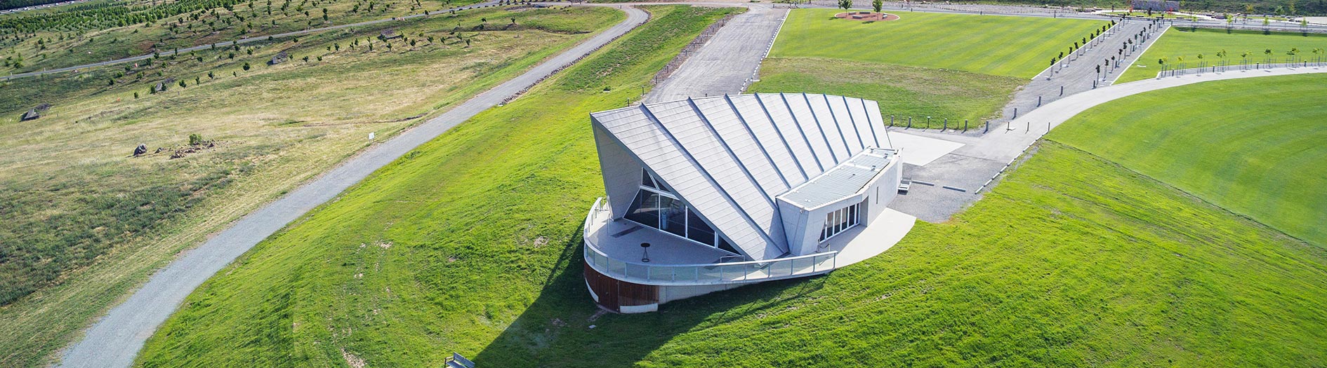 Aerial photo of the Margaret Whitlam Pavilion surrounded by bright green grass