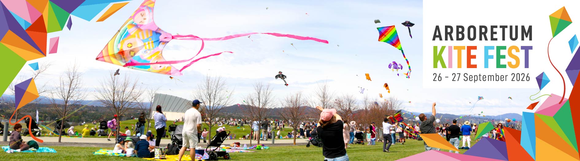 Crowds of families are picnicking and flying kites at the arboretum, with colourful 'kitefest' graphics overlaying the image